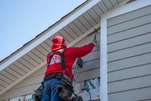 Technician works on a roof inspection.